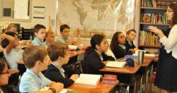 An instructor discusses items with the classroom