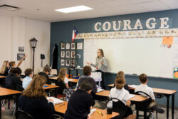 A teacher engages her class in a discussion of classic literature.